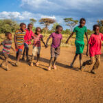 african kids playing football